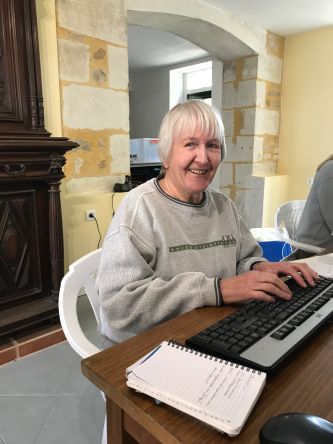 One of our volunteers, Rhona working on the blog at her desk