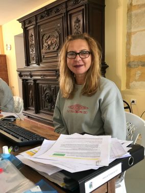 One of our volunteers, Susan, working on the applications at her desk