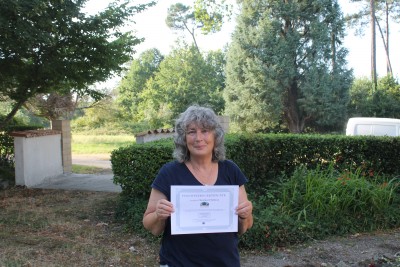 Volunteer Christine with her certificate